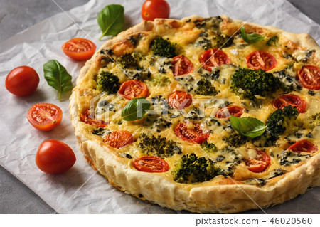 Homemade tart with broccoli, tomatoes and cheese. 46020560