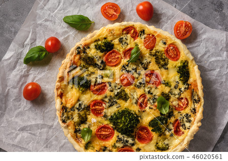 Homemade tart with broccoli, tomatoes and cheese. Homemade tart with broccoli, tomatoes and cheese. 46020561