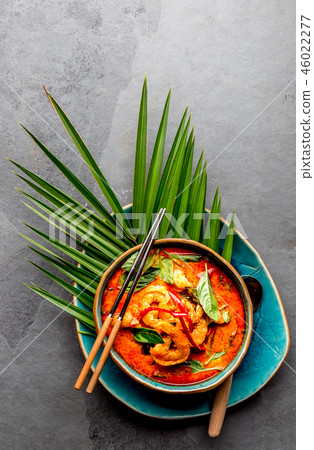 THAI SHRIMPS RED CURRY. Thailand Thai tradition red curry soup with shrimps prawns and coconut milk 46022277