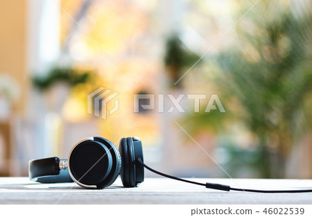 Pair of headphones on a bright background 46022539