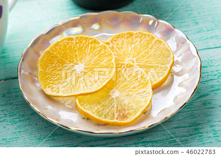 slices of lemon on a saucer slices of lemon on a saucer 46022783
