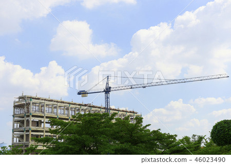 unfinished building with a town in background unfinished building with a town in background 46023490