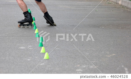 Boy riding on roller skates outdoor. 46024528