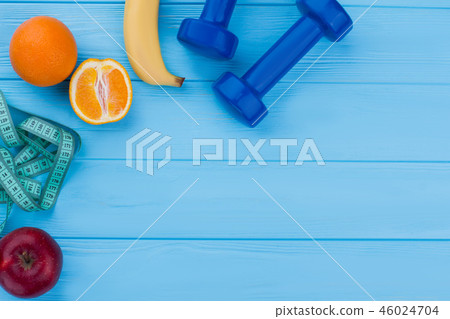Fitness equipment, fruits and copy space. 46024704