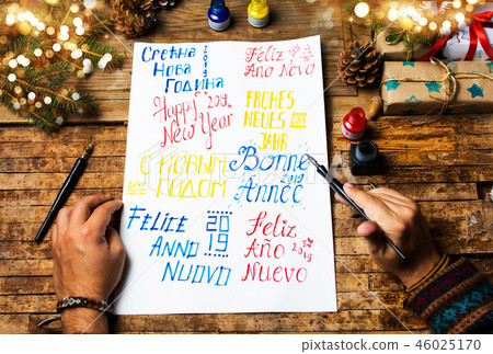 Writing a Happy new year card in various languages 46025170