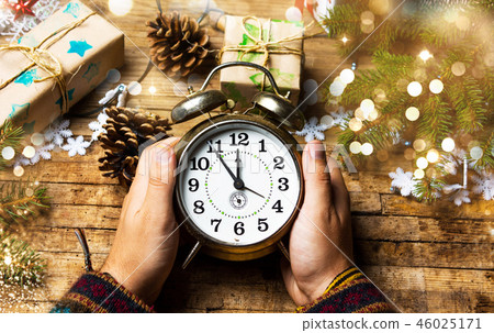 Person holding a vintage clock Person holding a vintage clock 46025171