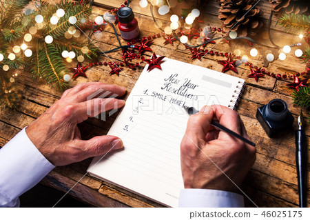 Senior writing new year resolutions 46025175