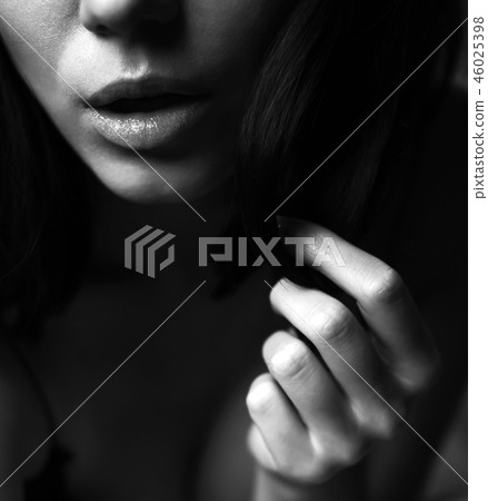 Portrait of a woman with sensual lips Portrait of a woman with sensual lips 46025398
