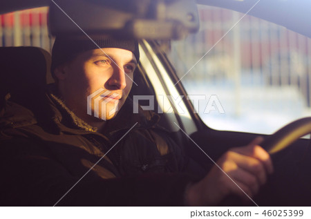 male driver drives a car 46025399