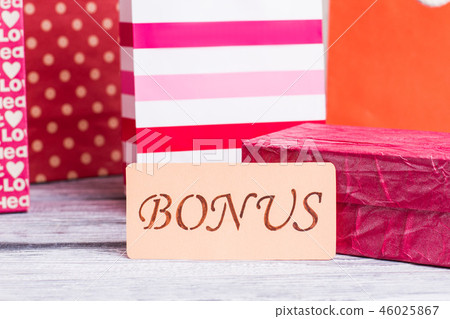 Card with inscription bonus and shopping bags. Card with inscription bonus and shopping bags. 46025867