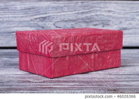 Pink gift box on wooden background. Pink gift box on wooden background. 46026366