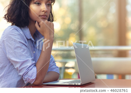 Stressed hipster businesswoman working on laptop in her office Stressed hipster businesswoman working on laptop in her office 46028761