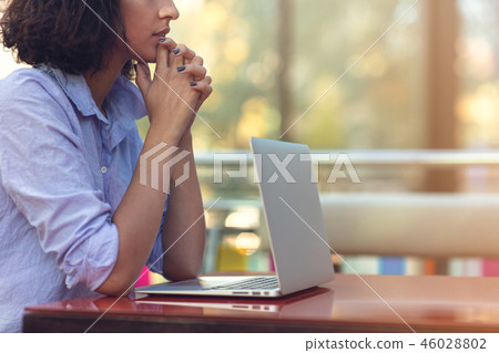 Stressed hipster businesswoman working on laptop in her office Stressed hipster businesswoman working on laptop in her office 46028802