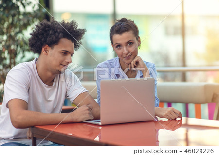 Two freelance working in coffee shop, Nomad worker conceptual, couple work together in cafe with Two freelance working in coffee shop, Nomad worker conceptual, couple work together in cafe with 46029226