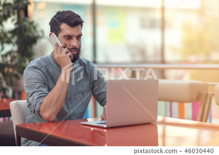 Excited happy bearded freelancer reading email with results about victory in modern online contest Excited happy bearded freelancer reading email with results about victory in modern online contest 46030440