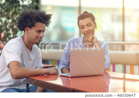 Two freelance working in coffee shop, Nomad worker conceptual, couple work together in cafe with Two freelance working in coffee shop, Nomad worker conceptual, couple work together in cafe with 46030647