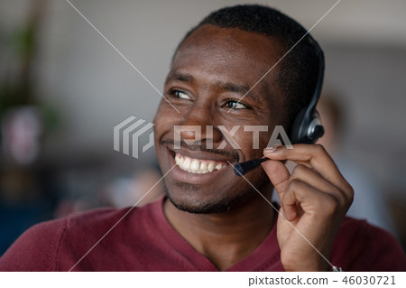 Emotional dark skinned male freelancer celebrating completed project successfully. Emotional dark skinned male freelancer celebrating completed project successfully. 46030721