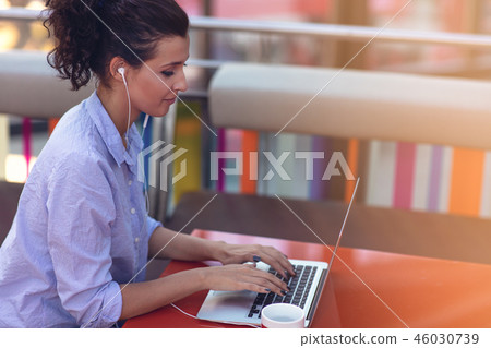 Mixed race female performing business negotiations on video chat. Telecommuting concept. Mixed race female performing business negotiations on video chat. Telecommuting concept. 46030739