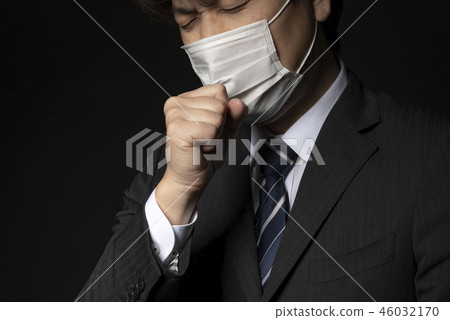 Men in a suit with a mask 46032170