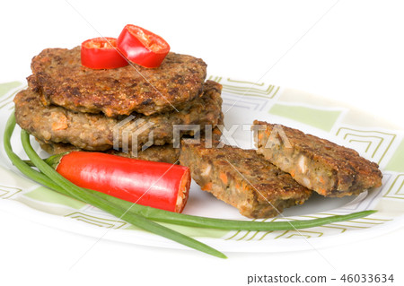 liver pancakes or cutlets with chili pepper and green onions isolated on white background liver pancakes or cutlets with chili pepper and green onions isolated on white background 46033634