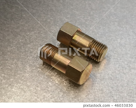 Close up metal bolt on steel sheet background 46033830