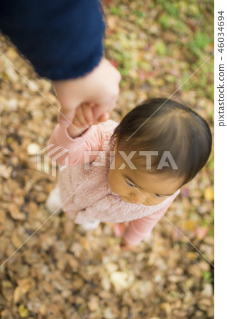 baby walking with hands up