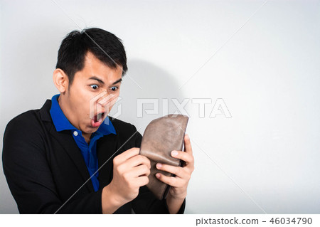businessman gasping in shock money in his walle 46034790