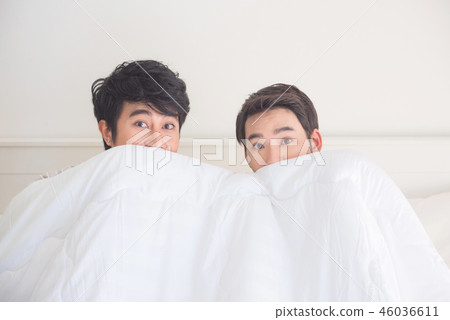 Two asian men with shocked face under sheet  46036611