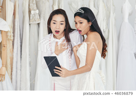 Bride and dressmaker surprise together Bride and dressmaker surprise together 46036879