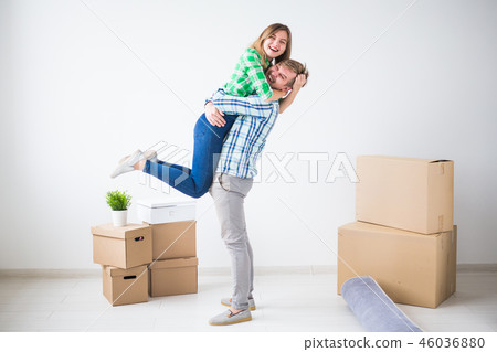 Family, new apartment and relocation concept - Young couple moving in new house Family, new apartment and relocation concept - Young couple moving in new house 46036880