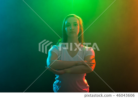 Modern dance, jazz funk and people concept - Close up portrait of young woman on colored background. Modern dance, jazz funk and people concept - Close up portrait of young woman on colored background. 46043606