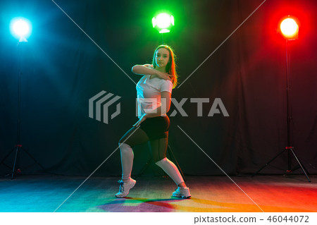 Hip-hop, jazz-funk, tecktonik, waacking, trance and street dances concept - Young woman dancing jazz Hip-hop, jazz-funk, tecktonik, waacking, trance and street dances concept - Young woman dancing jazz 46044072
