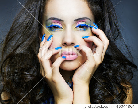 Beautiful woman with bright makeup and manicure Beautiful woman with bright makeup and manicure 46044864