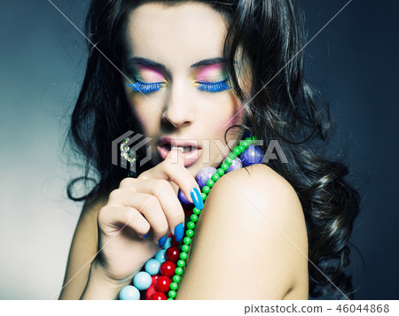 Beautiful girl with bright beads Beautiful girl with bright beads 46044868