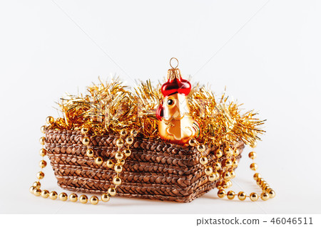 Golden glass rooster in box with tinsel and beads. Golden glass rooster in box with tinsel and beads. 46046511
