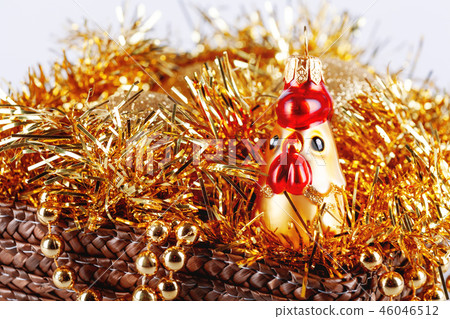 Golden glass rooster in box with tinsel and beads. Golden glass rooster in box with tinsel and beads. 46046512