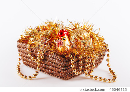 Golden glass rooster in box with tinsel and beads. Golden glass rooster in box with tinsel and beads. 46046513