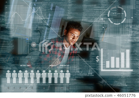 Young concentrated indian PPC specialist looking over advertising conversion Young concentrated indian PPC specialist looking over advertising conversion 46051776