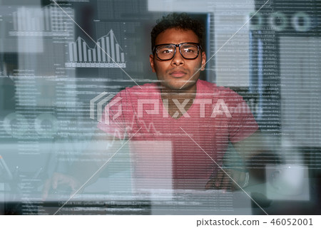 Young spectacled concentrated indian big data developer 46052001