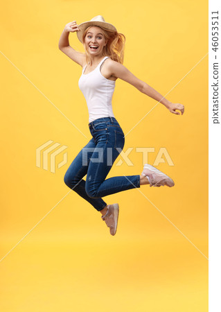 Happiness, dream, fun, joy, summer concept. Very excited happy cute caucasian teen is jumping up, in 46053511