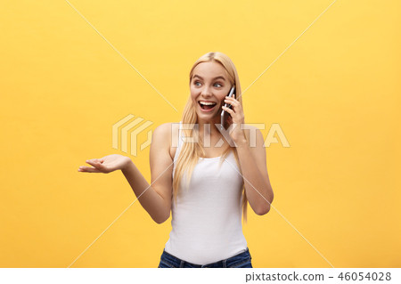 Image of gorgeous woman in casual being surprised or excited to receive pleasant talk on her cell 46054028