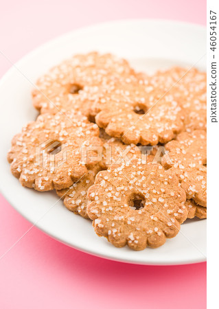 Christmas biscuits with sugar crystals. Christmas biscuits with sugar crystals. 46054167