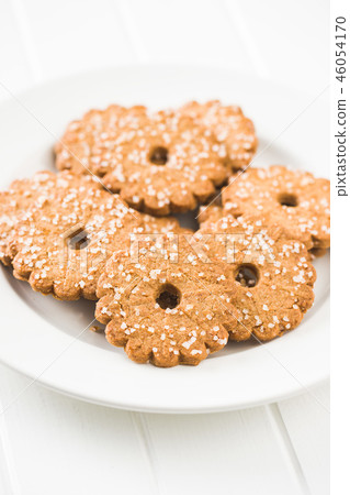 Christmas biscuits with sugar crystals. Christmas biscuits with sugar crystals. 46054170