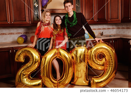 New 2019 Year is coming. Group of cheerful New 2019 Year is coming. Group of cheerful 46054173