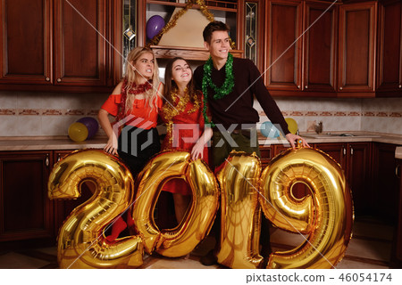 New 2019 Year is coming. Group of cheerful New 2019 Year is coming. Group of cheerful 46054174