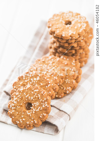 Christmas biscuits with sugar crystals. Christmas biscuits with sugar crystals. 46054182