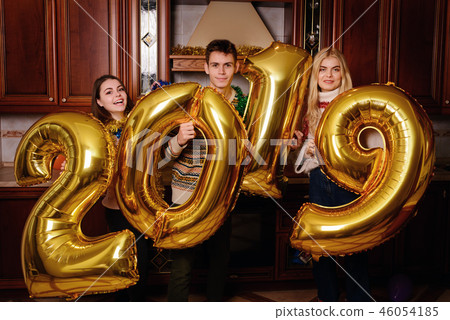 New 2019 Year is coming. Group of cheerful New 2019 Year is coming. Group of cheerful 46054185