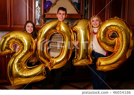 New 2019 Year is coming. Group of cheerful New 2019 Year is coming. Group of cheerful 46054186