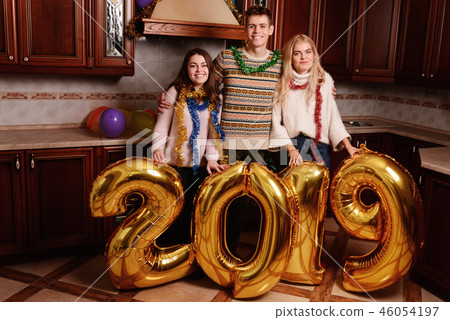 New 2019 Year is coming. Group of cheerful New 2019 Year is coming. Group of cheerful 46054197