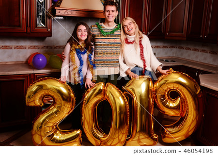 New 2019 Year is coming. Group of cheerful New 2019 Year is coming. Group of cheerful 46054198